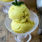Mango coconut ice cream in a glass dish.