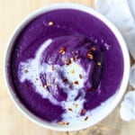 Purple soup in a white bowl.
