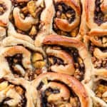 A close up of a pan of cinnamon rolls