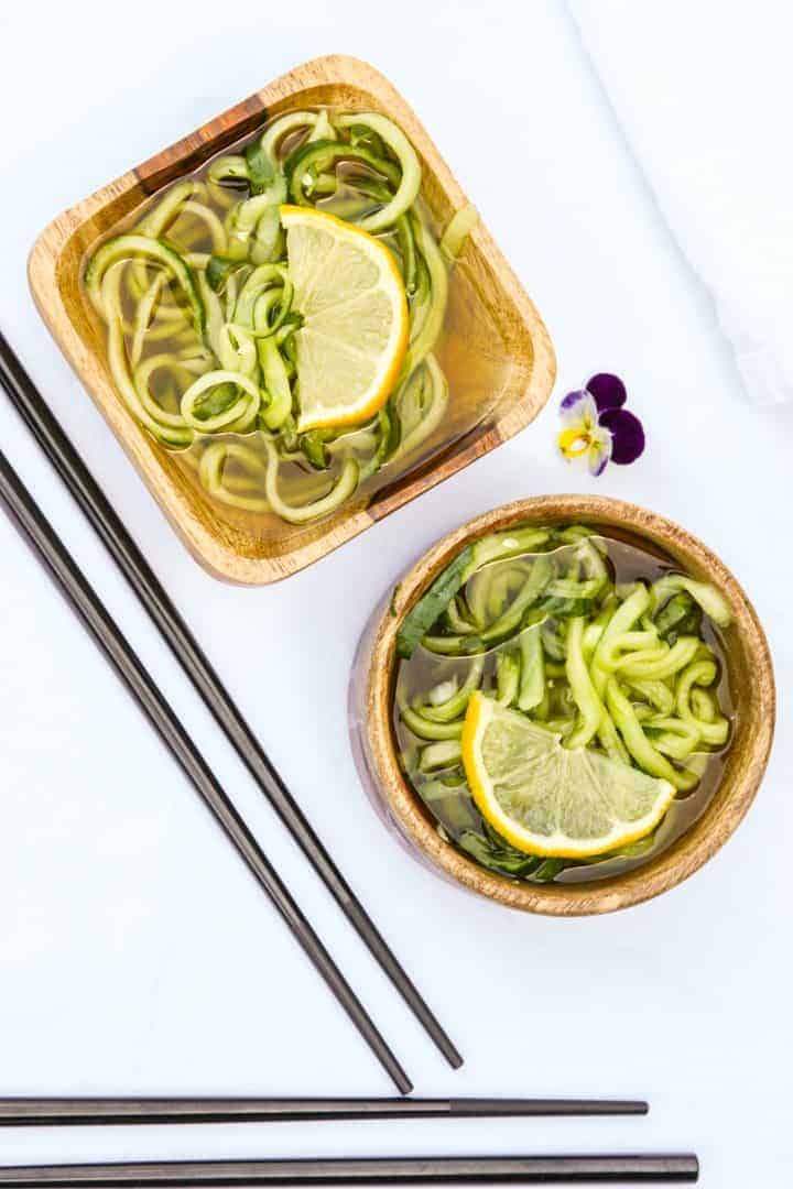 two servings of sunomono salad in wooden bowls