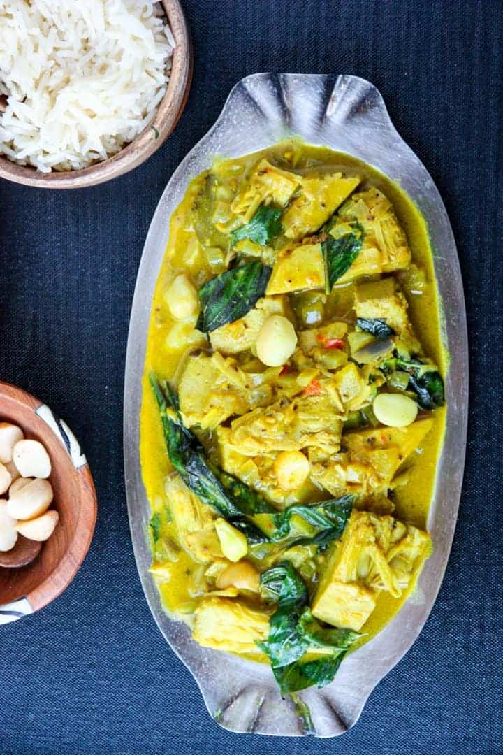 A platter sitting on top of a table filled with food
