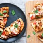 A slice of pizza sitting on top of a wooden table