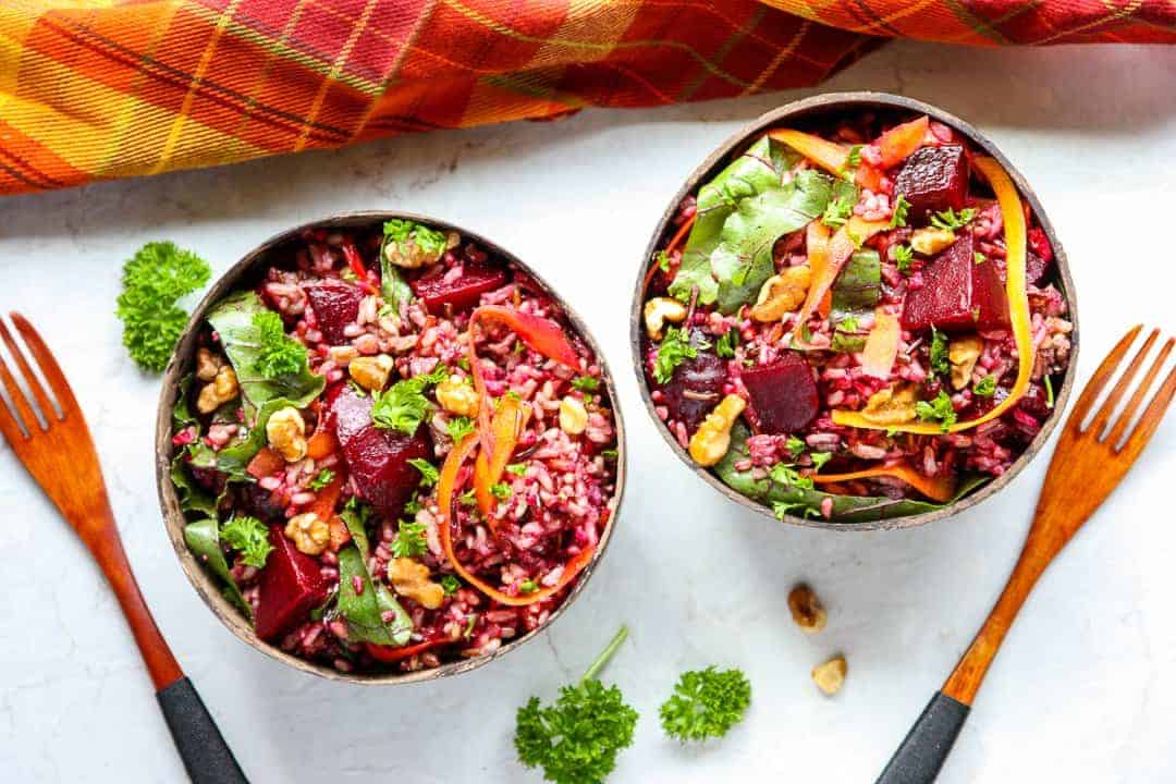 Two bowls of salad on a table
