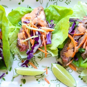 A plate of wraps, with Lettuce and Steak