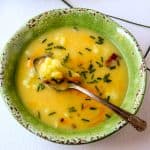 A bowl of soup with a spoon