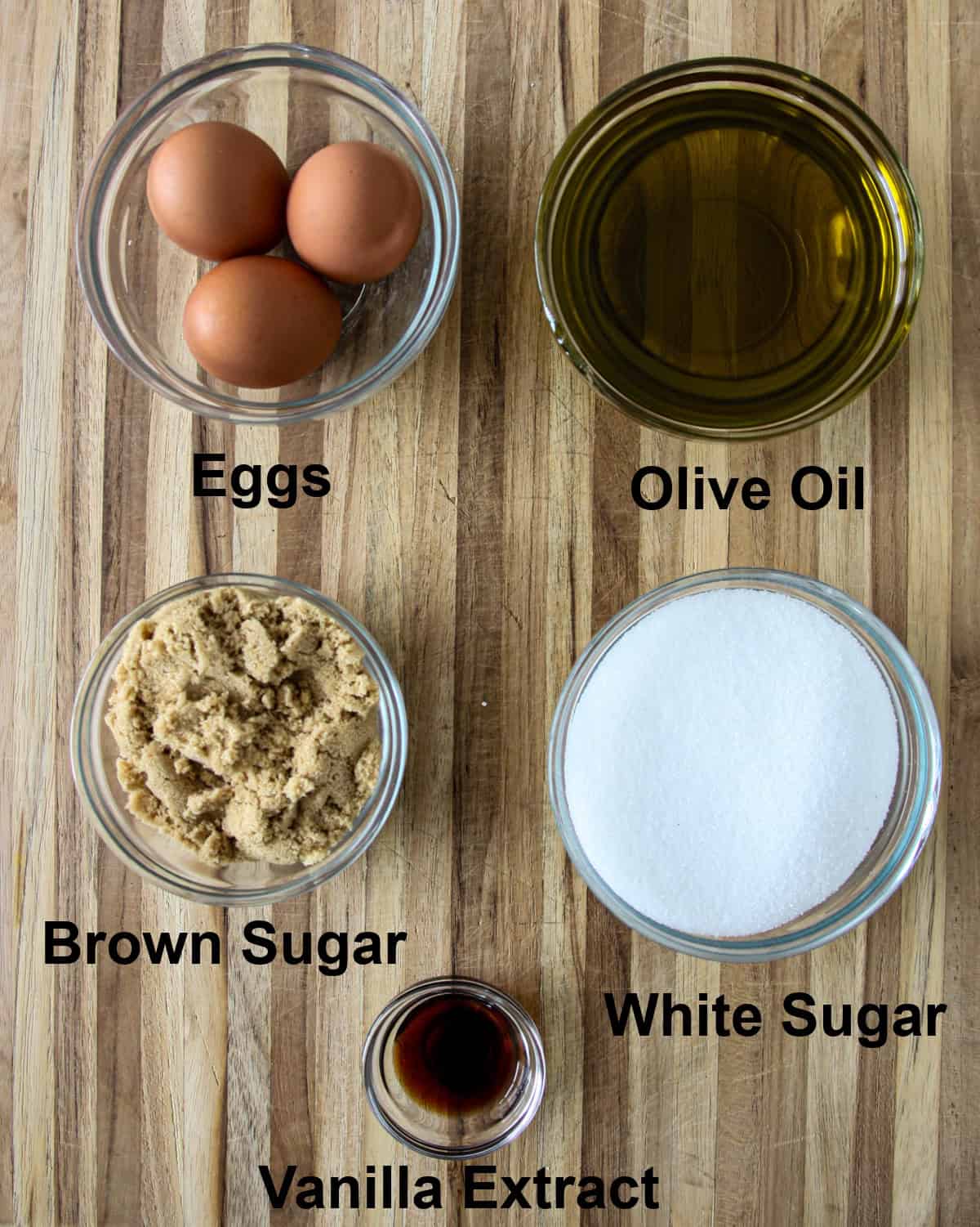 The wet ingredients for this recipe in glass bowls.