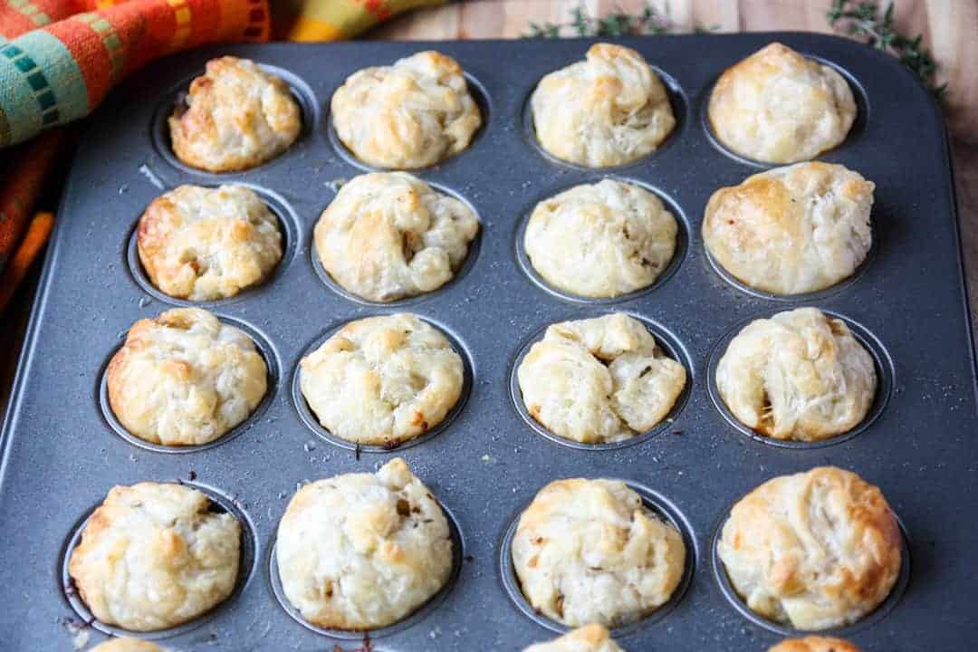 Baked puff pastry appetizers in a mini muffin pan