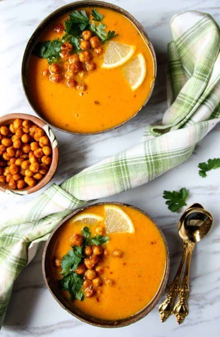 A bowl of soup on a table, with Sweet potato