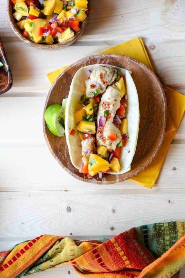 A taco sitting on top of a wooden table