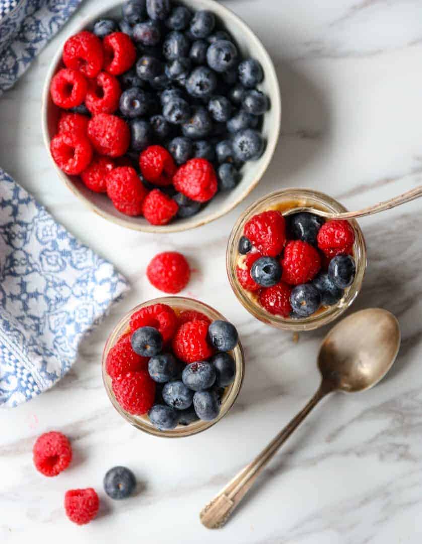 A bowl of fruit on a table, with Oatmeal