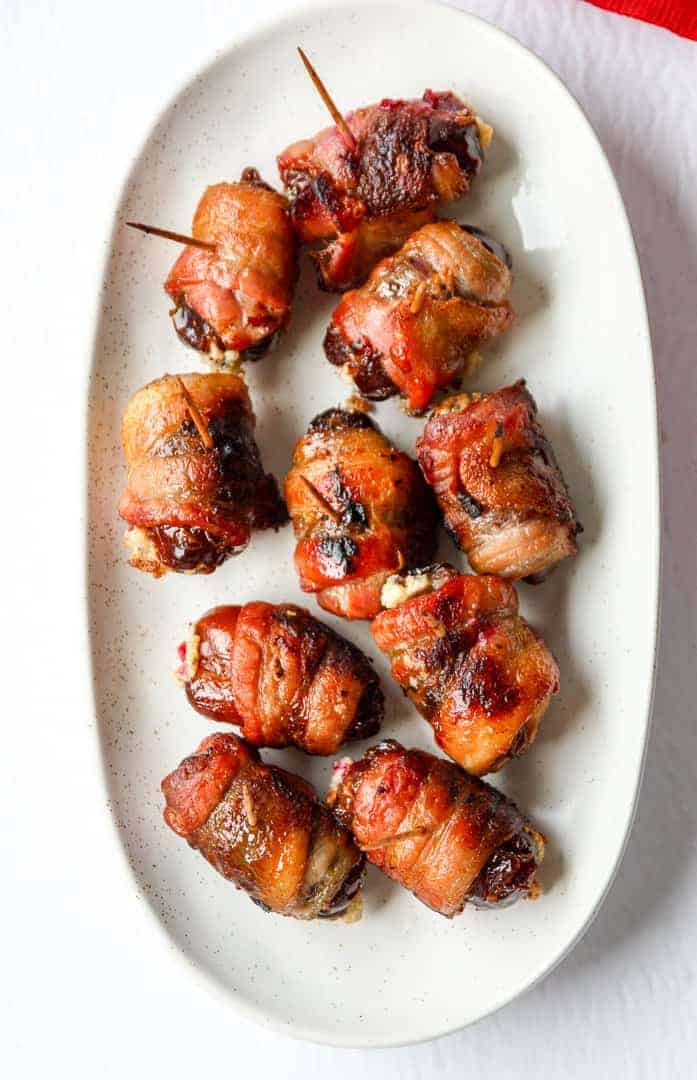 bacon wrapped dates on a plate