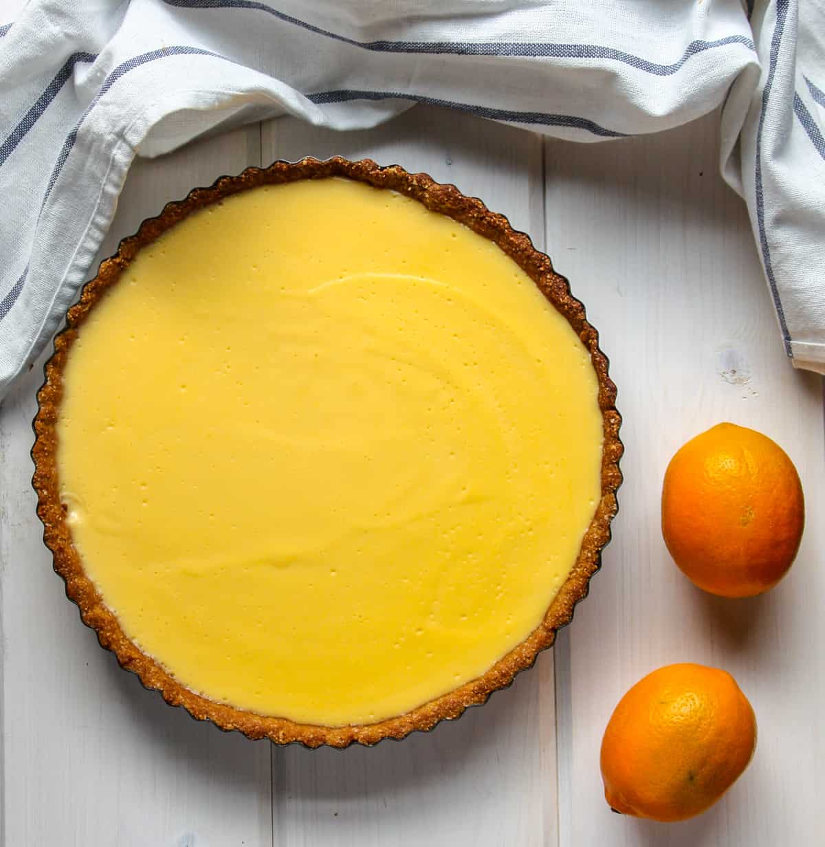 A Meyer Lemon Curd Tart on a table.