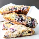 Three gluten-free blueberry scones in a stack.