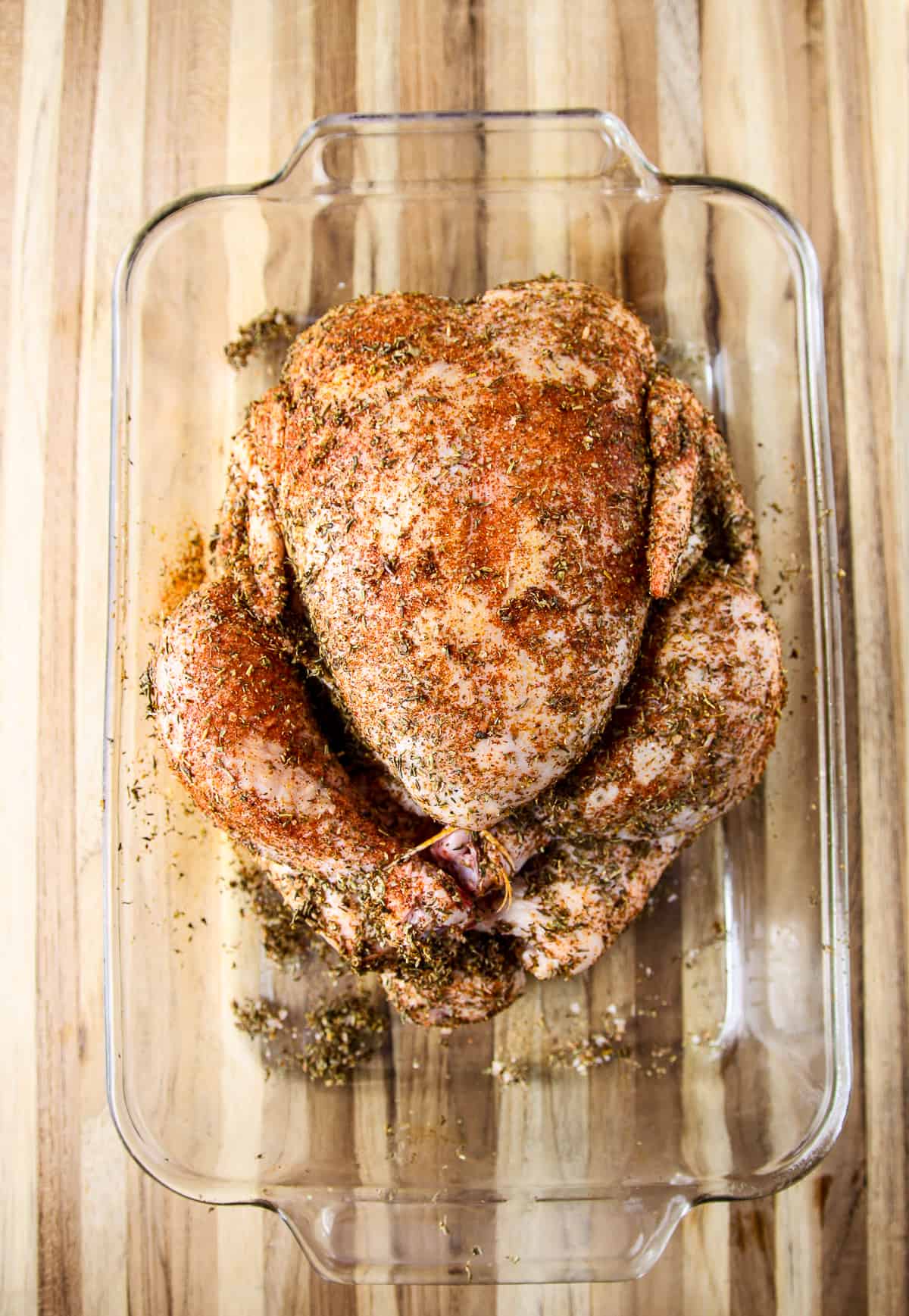 The chicken is now rubbed with seasonings.