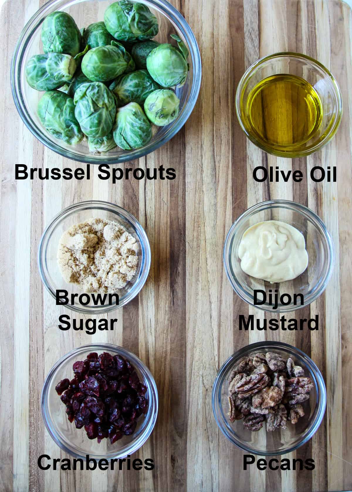 The ingredients for making this recipe in glass bowls on a wooden board.
