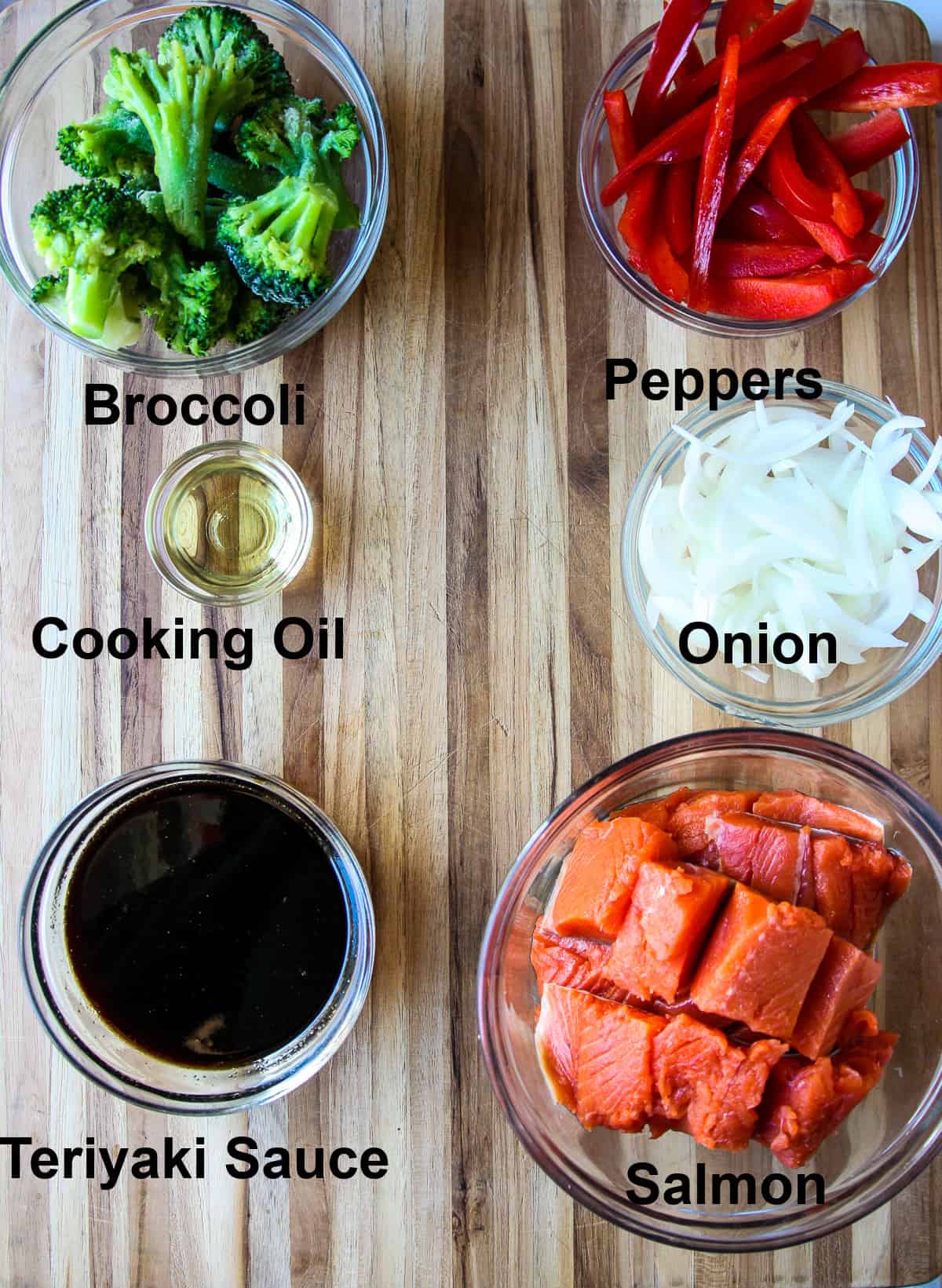 The ingredients for this recipe, in glass bowls on a wooden board.