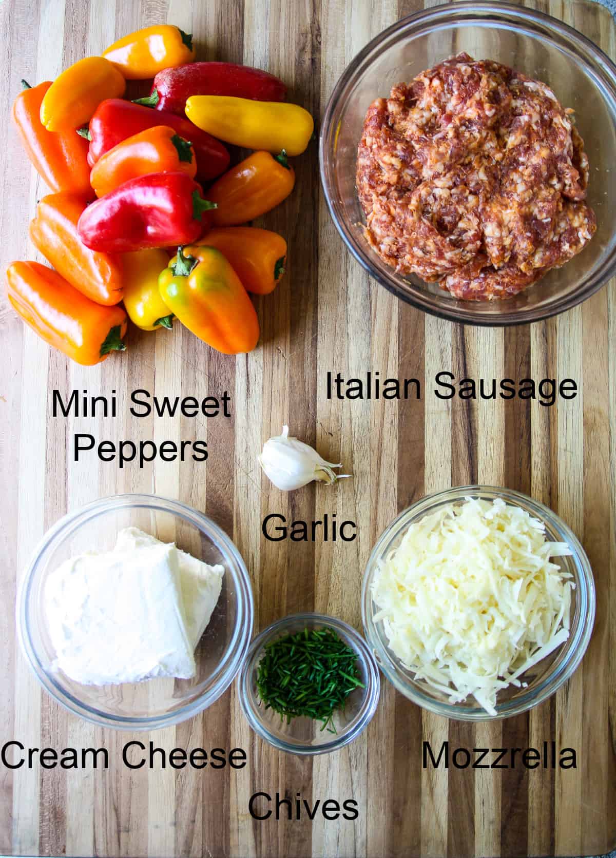 The recipe ingredients in glass dishes on a wooden board.