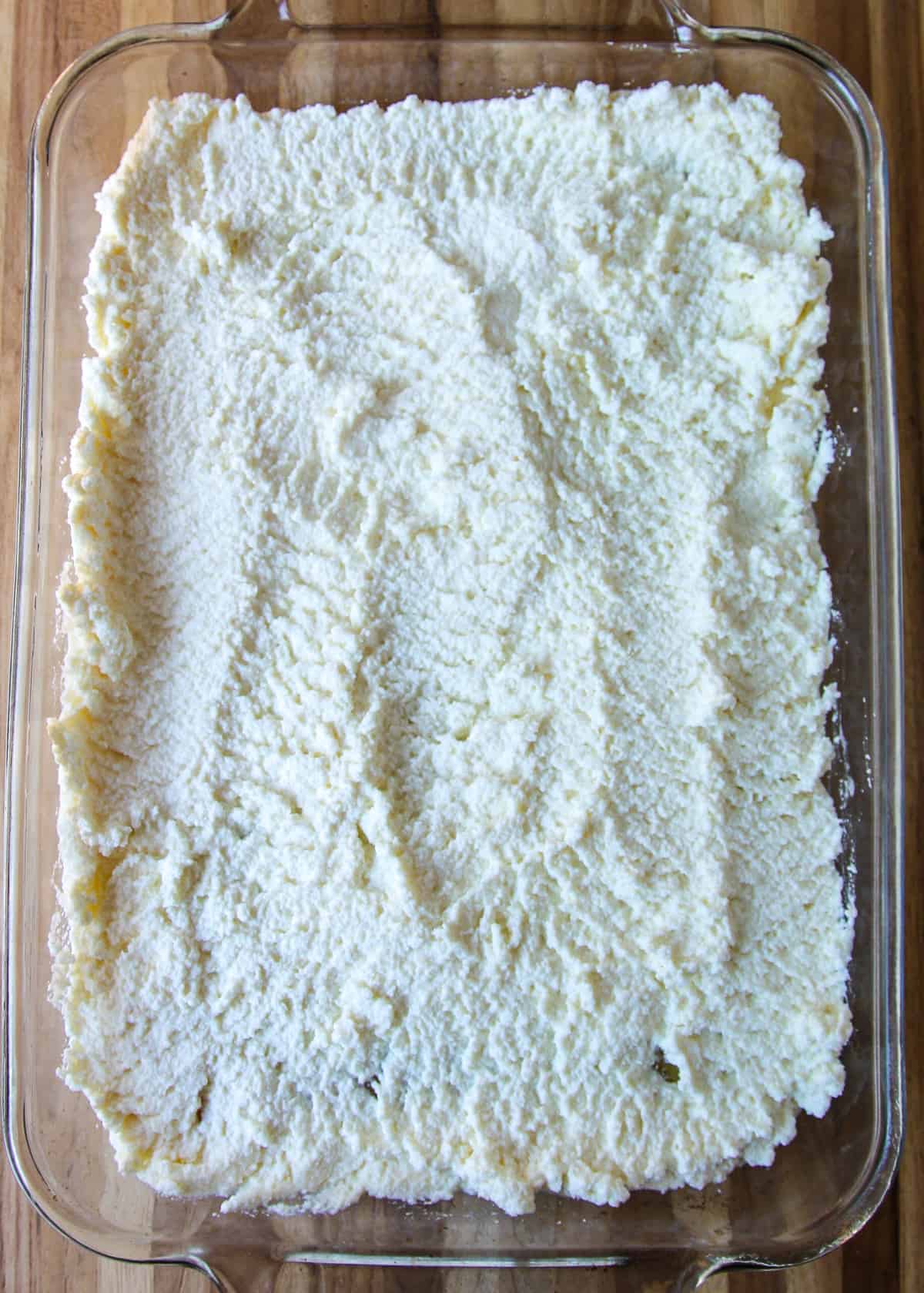 A layer of ricotta cheese.