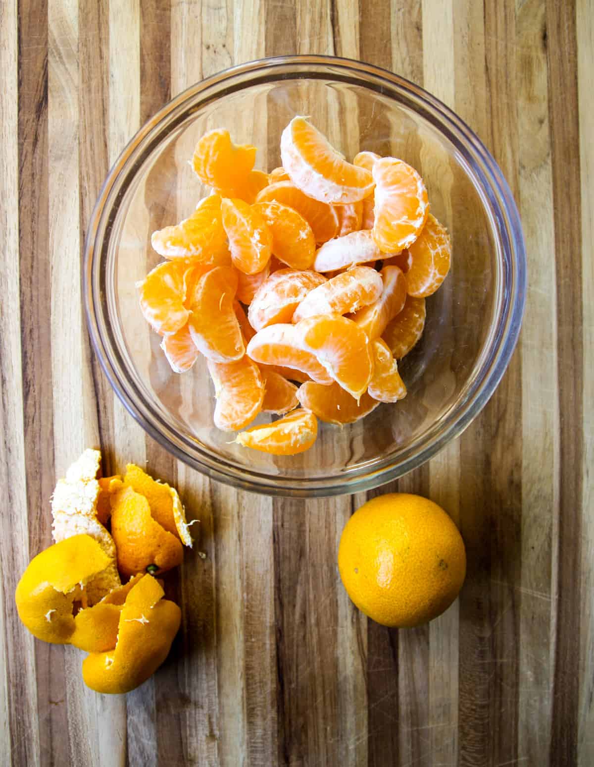 Peeled orange segments in a glass bowl.