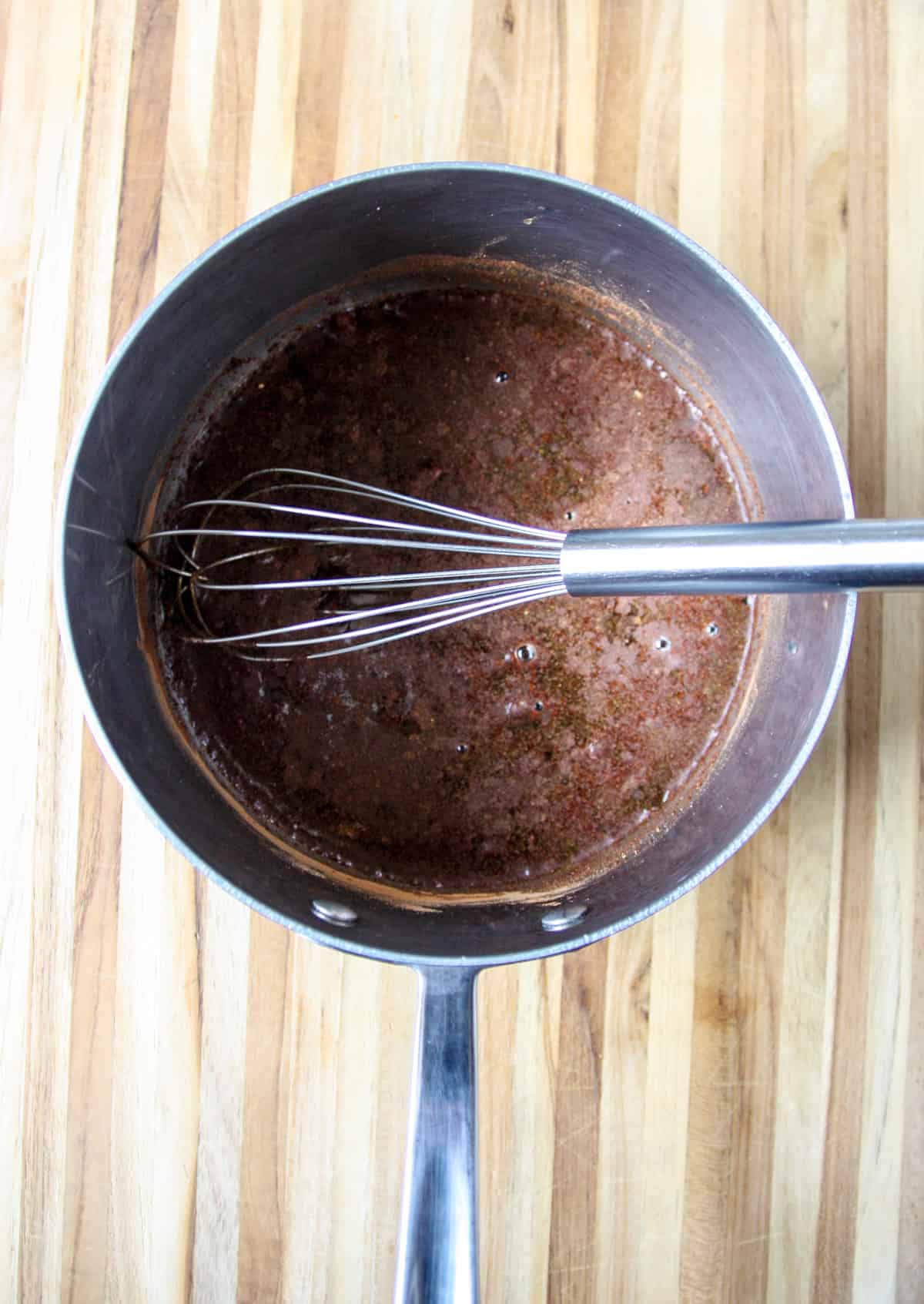 All of the ingredients combined in a stainless steel saucepan.