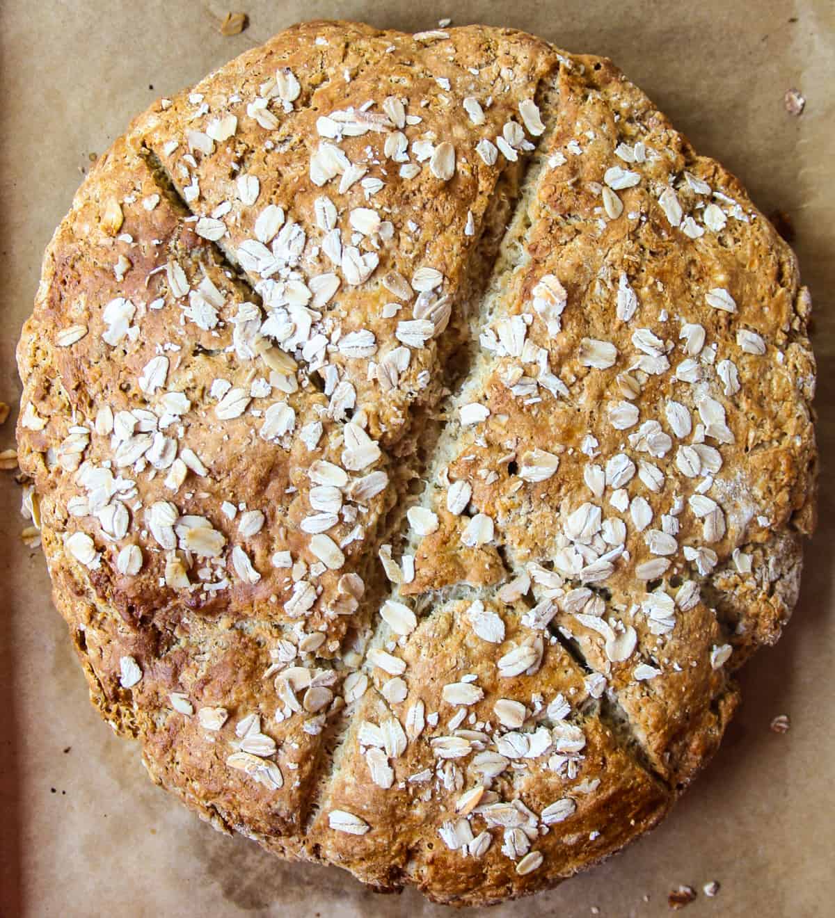 A freshly baked, crusty loaf of gluten-free Irish soda bread.