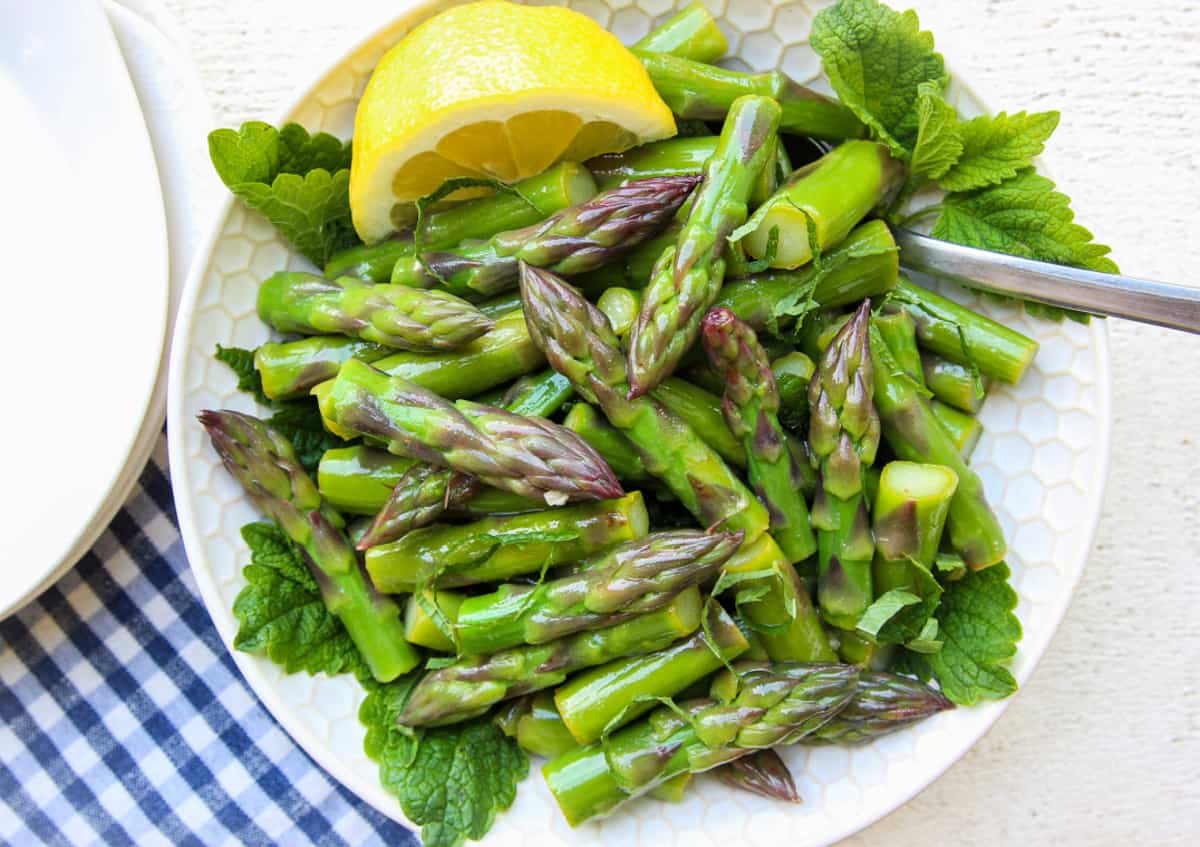 Marinated asparagus salad on a plate.