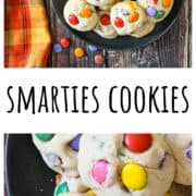 Cookies studded with colorful candies on a black plate.