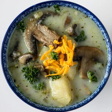 Potato mushroom soup in a blue bowl.