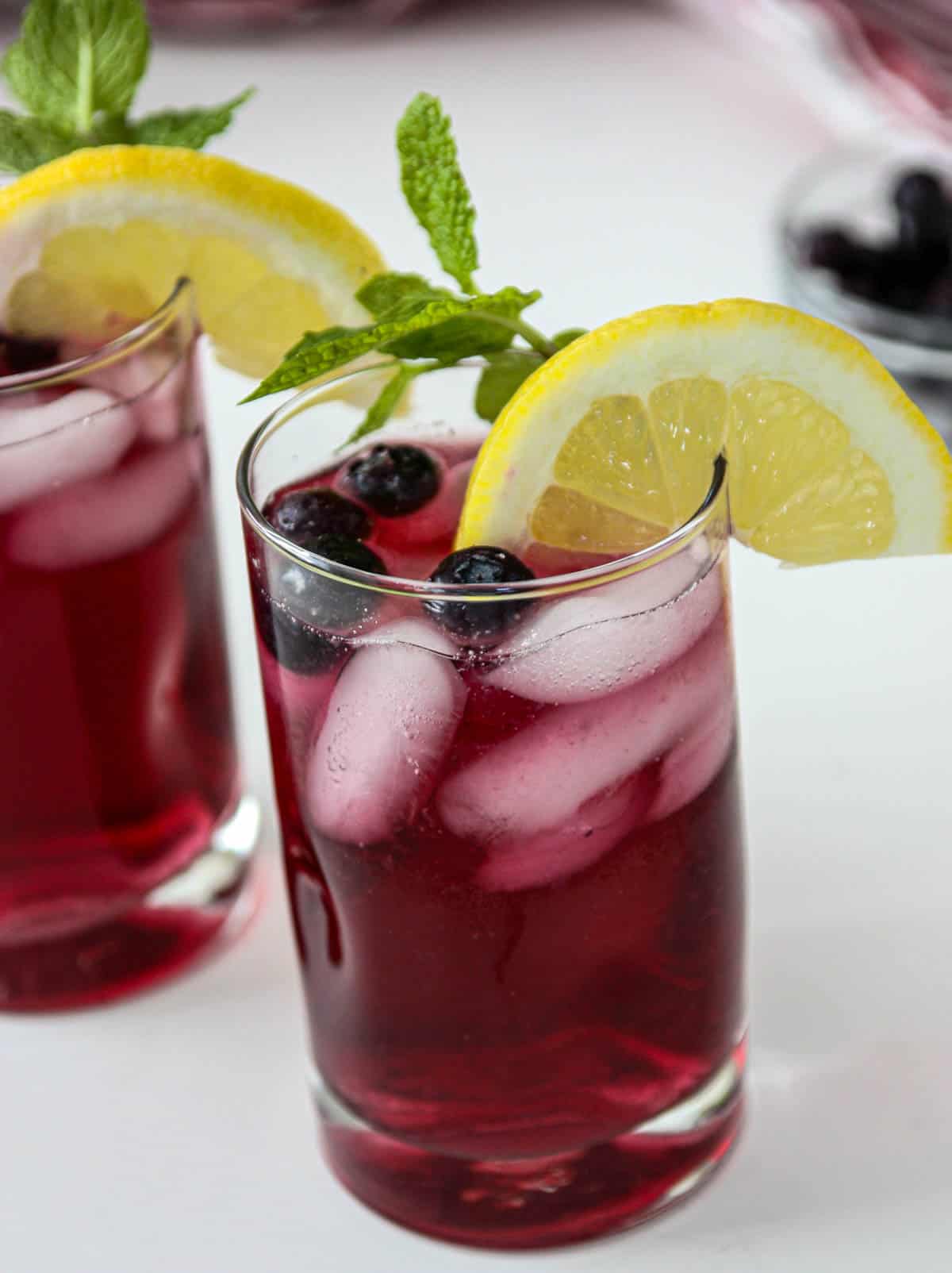 A glass of blueberry iced tea.